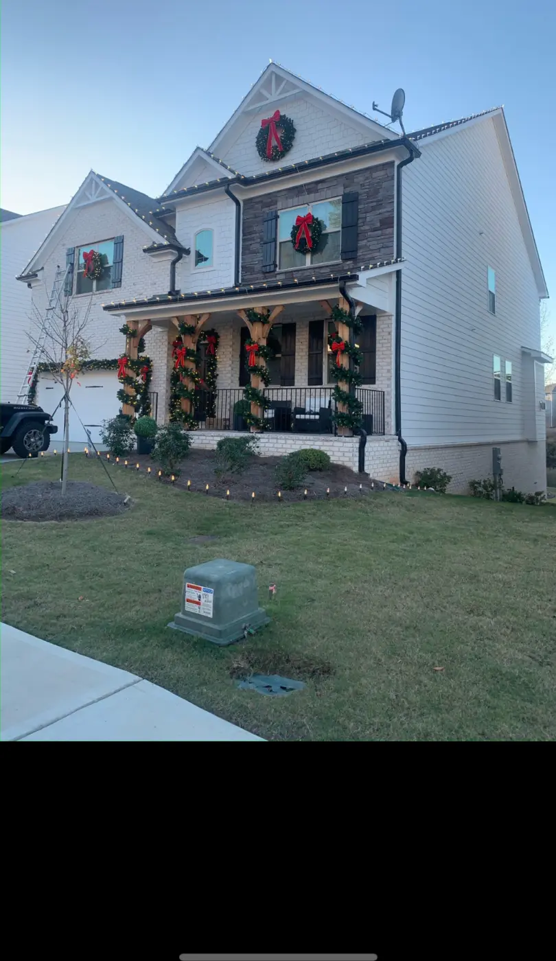Green wreaths, garland and traditional red bows